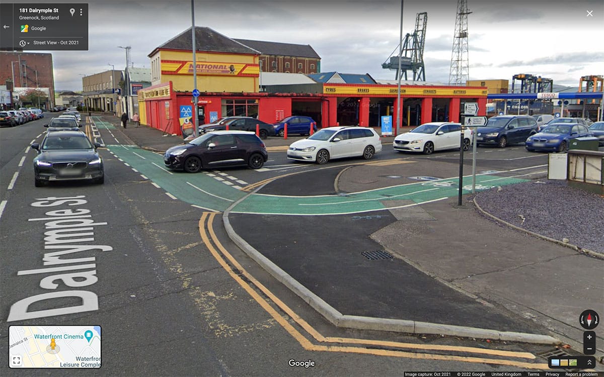 Greenock–Battery Park cycle route – painted lane turning across Laird St to protected lanes on Dalrymple St