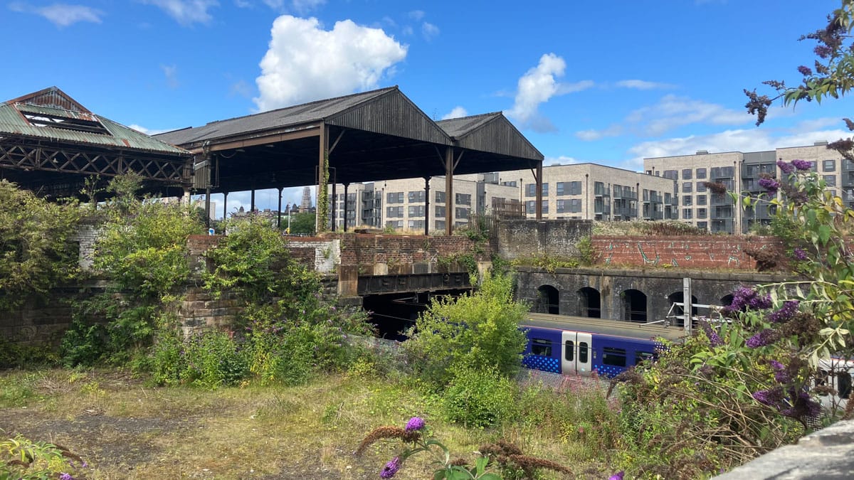 Meatmarket sheds with rail underneath and new flats in background